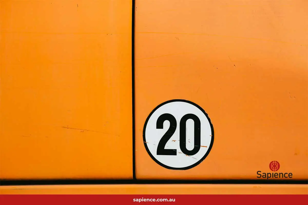the number 20 on an orange car door