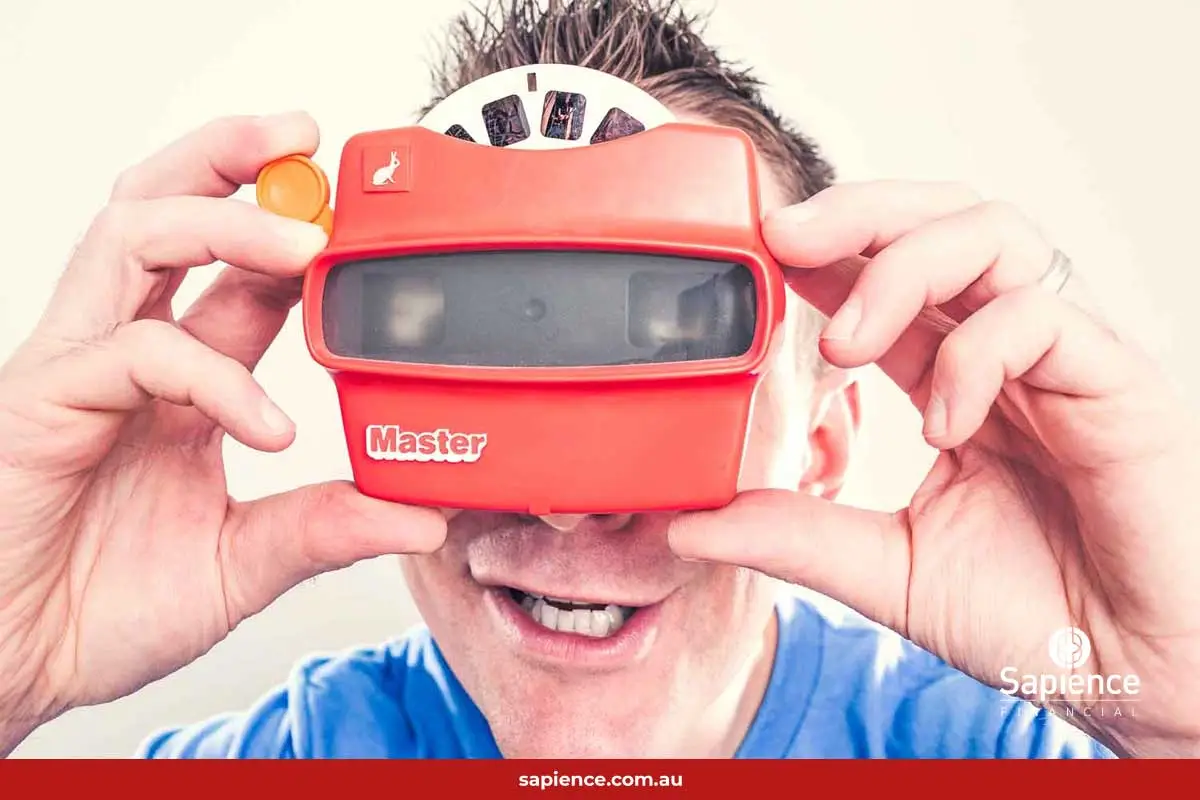 man looking through retro Viewfinder slide viewer