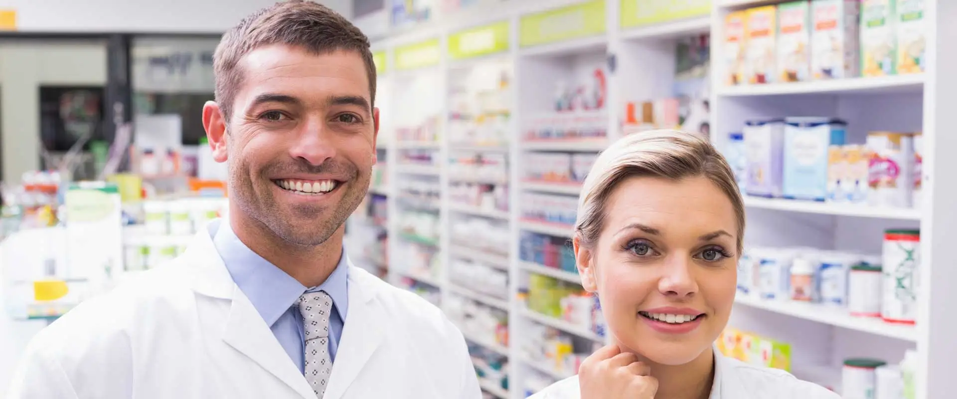 male and female chemist staff in store