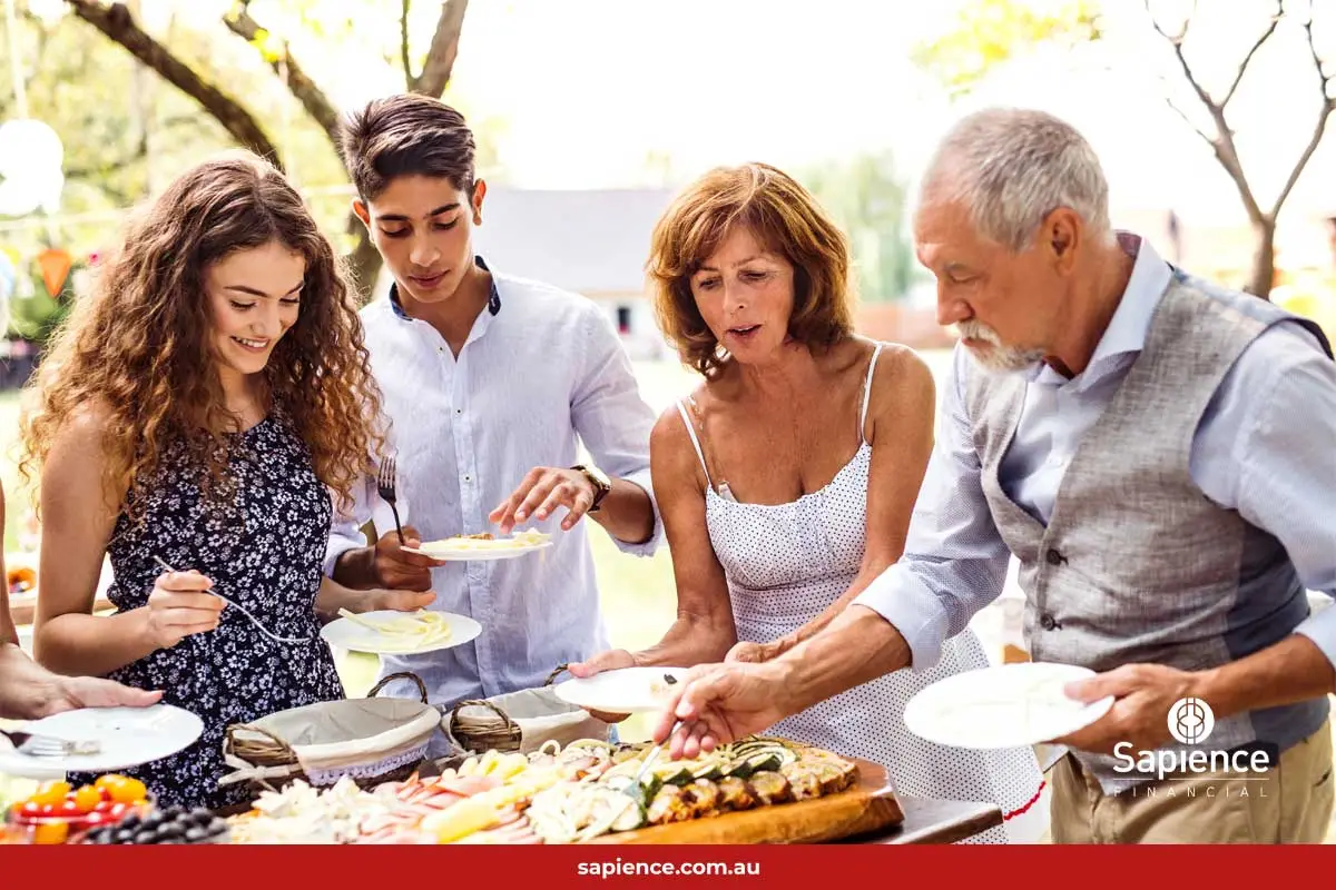 middle aged family enjoying a BBQ together