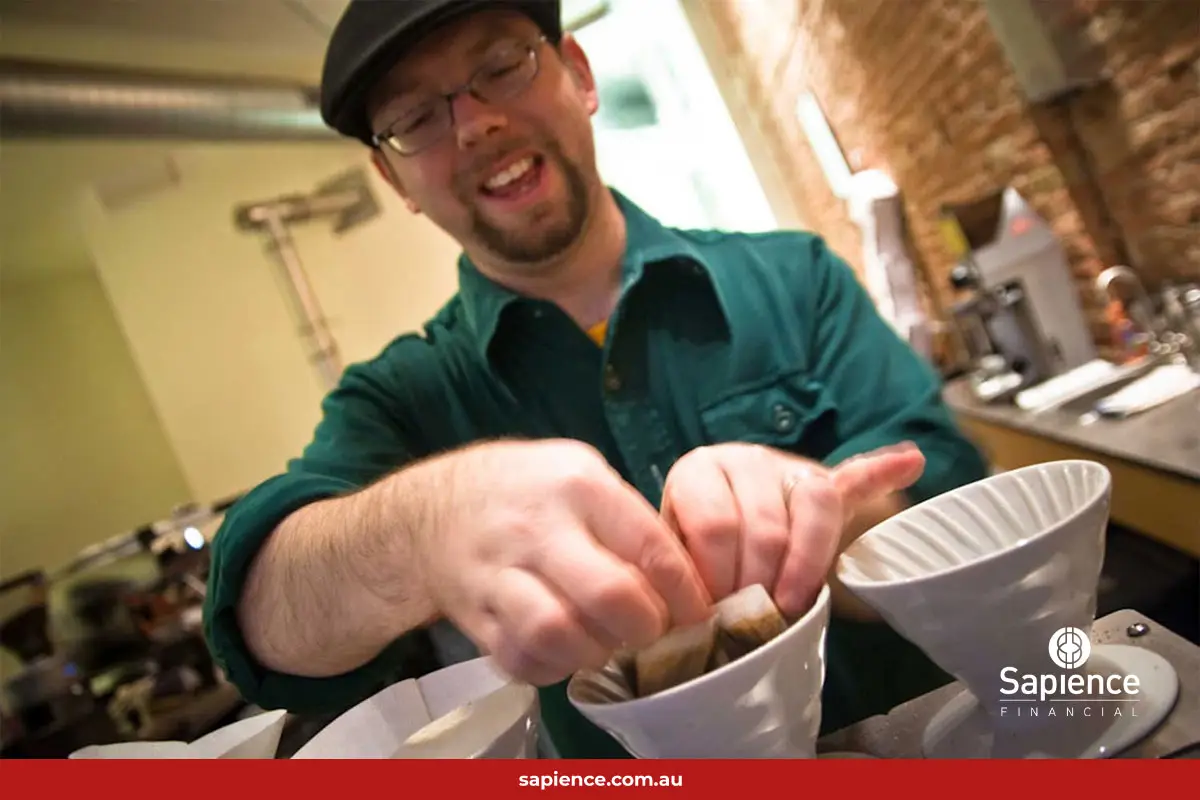 smiling barista making coffee