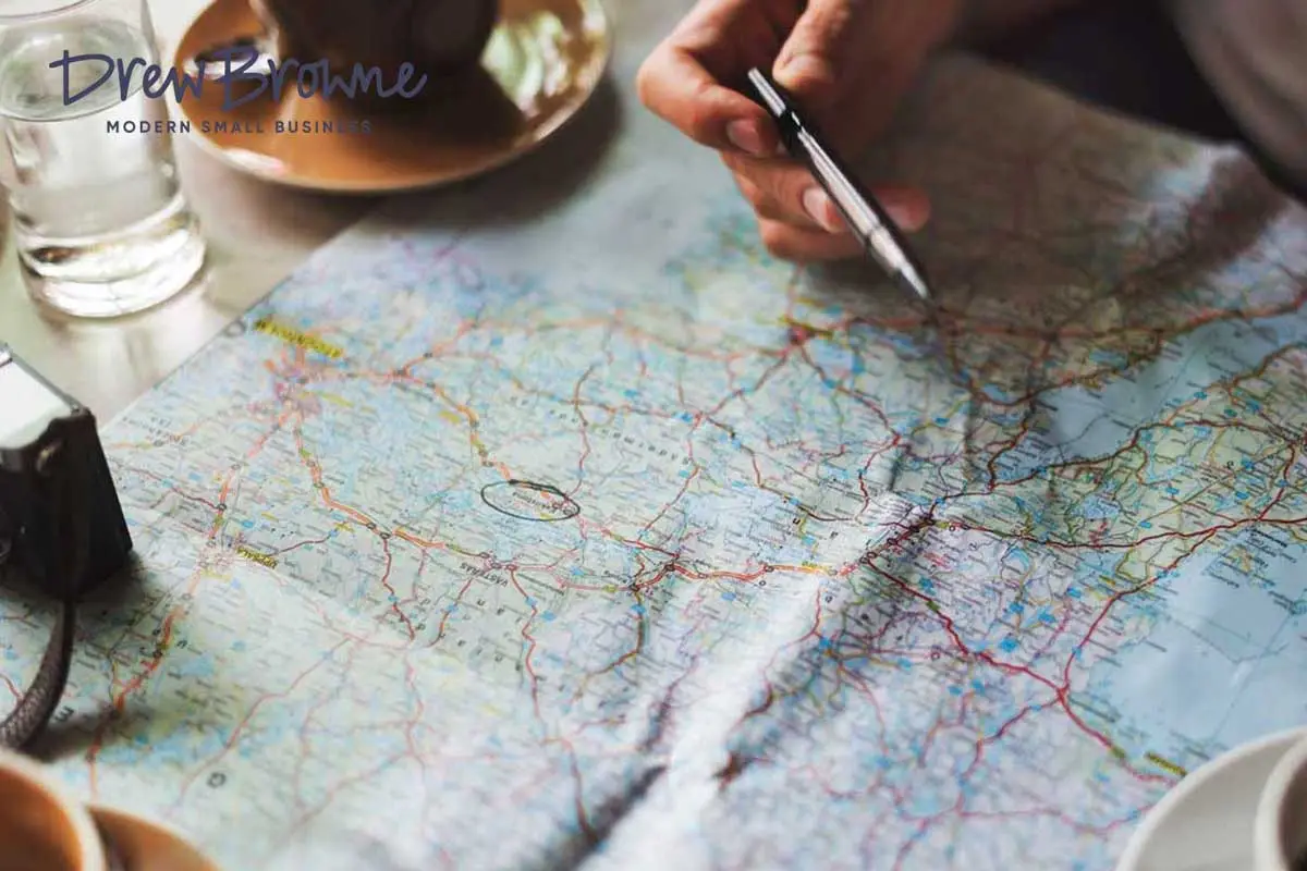 looking at a regional paper road map over coffee