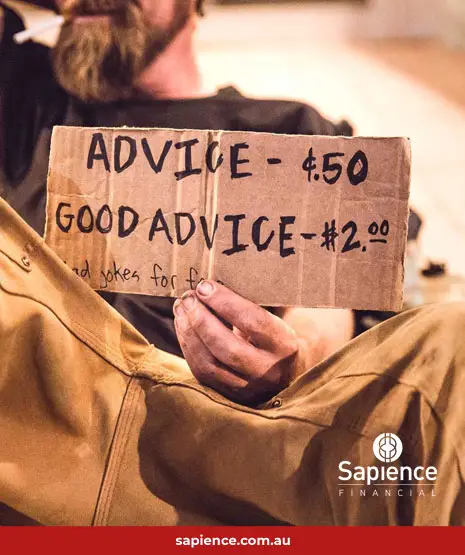homeless person with cardboard sign