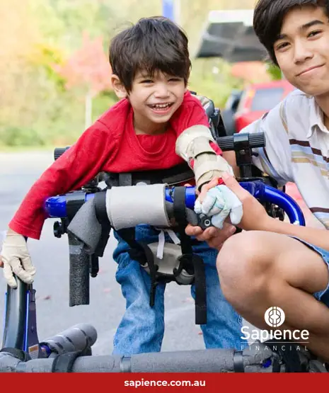 older brother supporting his younger brother in wheel chair