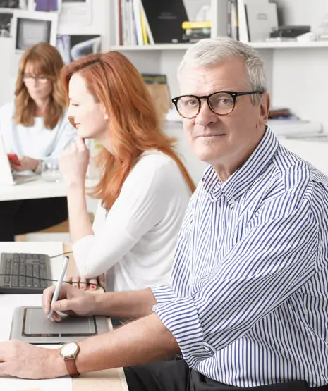 Multiple business owners at a work desk
