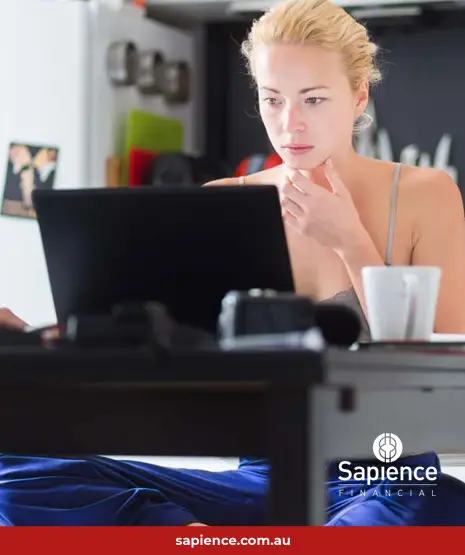 small business woman working on laptop compute at kitchen tabnle