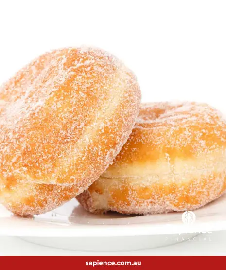 two identical jam donuts on a plate