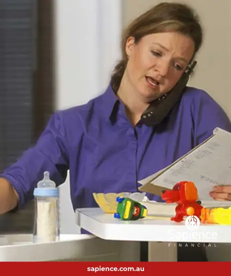 busy business woman on phone and feeding her baby at the same time