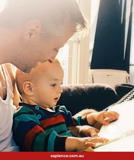 grandfather and grandchild reading together