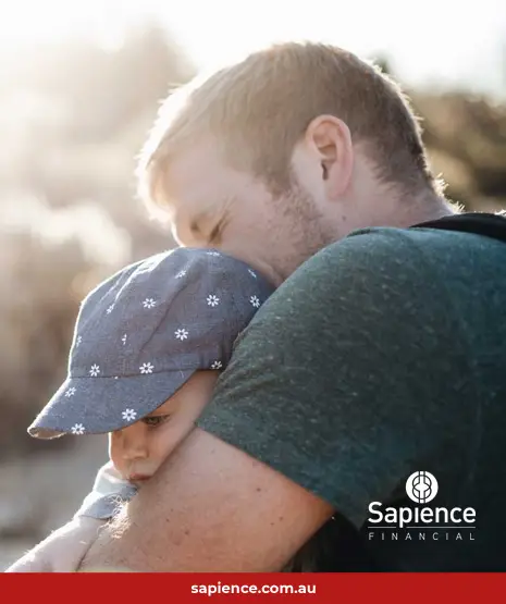 father hugging young child
