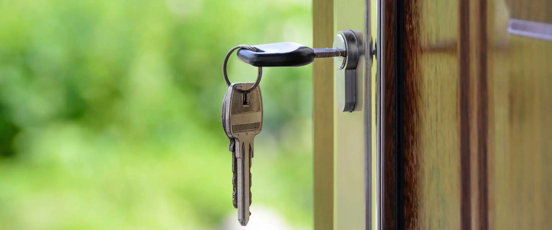 keys in the open door of a property