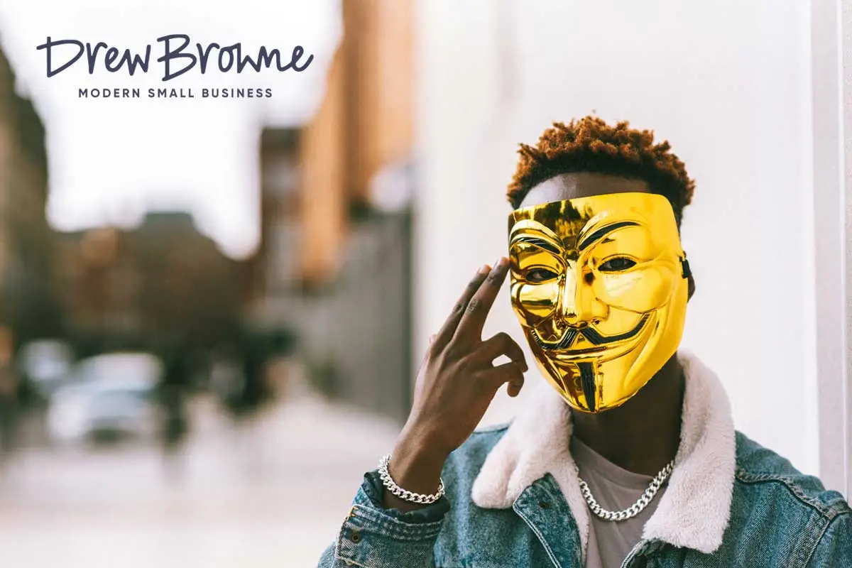 man wearing a golden face mask to hide his true identity